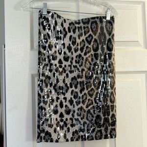 Snow leopard (?) print sequined skirt. Hits above the knee ;)